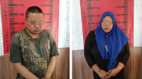 Pasangan suami-istri tertunduk malu di salah satu ruangan Kantor Polsek Umbulsari (beritalima.com/istimewa)